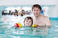 Cute little boy and his father having fun in Royalty Free Stock Photo