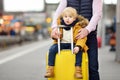 Cute little boy and his father waiting express train on railway station platform Royalty Free Stock Photo