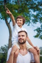 Dad and son resting outdoors Royalty Free Stock Photo