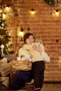 Cute little boy and his mother or grandmother on Christmas eve Royalty Free Stock Photo