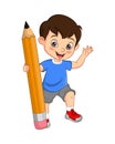 Cute little boy holding big pencil Royalty Free Stock Photo