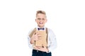 cute little boy holding books and smiling at camera Royalty Free Stock Photo