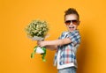 Cute little boy holding a bouquet of flowers Royalty Free Stock Photo