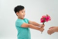 Cute little boy holding a bouquet of flowers. Mothers Day. International Women`s Day. Portrait of a happy little boy on a white Royalty Free Stock Photo