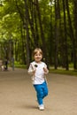 Cute little boy holding a large round lollipop on a stick. Joyful emotions. Sweets for small children. Summer outdoor activities. Royalty Free Stock Photo