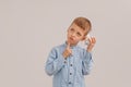 Cute little boy holding a piggy bank or money box. Concept child and money Royalty Free Stock Photo