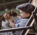 Cute, little boy hugging a cat Royalty Free Stock Photo