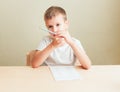 Cute little boy learning at home. Royalty Free Stock Photo