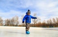 Cute little boy learning to skate in winter Royalty Free Stock Photo