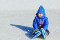 Cute little boy learning to skate in winter Royalty Free Stock Photo