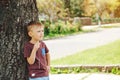 Cute little boy looking up the sky in sunny day. Child dreaming, hope concepts. Royalty Free Stock Photo