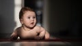 Cute little boy lying on his forearms on the floor. Royalty Free Stock Photo