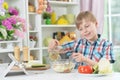 Cute little boy making dinner Royalty Free Stock Photo