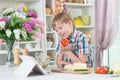 Portrait of cute little boy making dinner Royalty Free Stock Photo