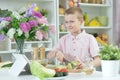 Cute little boy making dinner Royalty Free Stock Photo