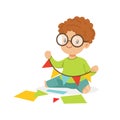 Cute little boy making a garland of pennants, kids creativity, education and child development, colorful character Royalty Free Stock Photo