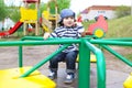 Cute little boy on merry-go-round Royalty Free Stock Photo