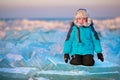 Cute little boy outdoors playing on winter beach Royalty Free Stock Photo