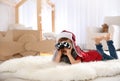 Cute little boy playing with binoculars and cardboard airplane Royalty Free Stock Photo