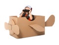 Cute little boy playing with binoculars and cardboard airplane Royalty Free Stock Photo