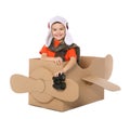 Cute little boy playing with binoculars and cardboard airplane on white Royalty Free Stock Photo