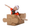 Cute little boy playing with cardboard airplane Royalty Free Stock Photo