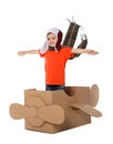 Cute little boy playing with cardboard airplane on white Royalty Free Stock Photo