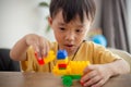 Cute little boy playing with colorful toys Royalty Free Stock Photo