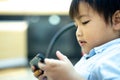 Cute little boy playing gadget