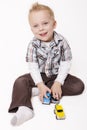 Cute Little Boy Playing with his Toys Royalty Free Stock Photo