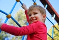 Cute little boy playing on monkey bars Royalty Free Stock Photo