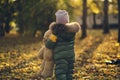 Cute little boy playing outdoors. Happy child walking in autumn park. Toddler baby boy wears trendy jacket. Autumn Royalty Free Stock Photo