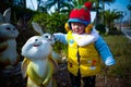 Cute little boy playing with rabbits Royalty Free Stock Photo