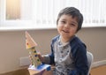 Cute little boy playing with spaceship, Happy child holding toy rocket, Portrait of funny kid, Toddler creativity, Concept for art Royalty Free Stock Photo