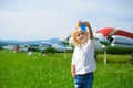 Cute little boy plays with a toy airplane at the airport Royalty Free Stock Photo