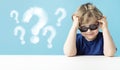 Cute little boy with queries Royalty Free Stock Photo