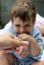 Cute toddler reacting emotionally, being delighted because he saw ladybug