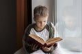 Cute little boy reading book Royalty Free Stock Photo