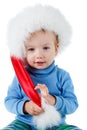 Cute little boy in the red furry Santa hat on a white Royalty Free Stock Photo