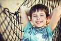 Cute little boy relaxing in a hammock Royalty Free Stock Photo