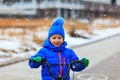 Cute little boy riding bike in winter, kids sport Royalty Free Stock Photo