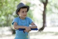 Cute little boy riding scooter outdoor on the street Royalty Free Stock Photo