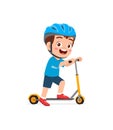 Cute Little Boy Riding Scooter And Wear Helmet