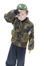 Cute little boy Salutes in Army outfit Royalty Free Stock Photo