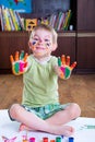 Cute little boy showing his colorful palms Royalty Free Stock Photo