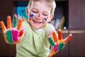 Cute little boy showing his colorful palms Royalty Free Stock Photo