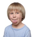 Cute little boy showing his tongue on white background Royalty Free Stock Photo