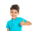 Cute little boy showing thumb-up gesture on white background Royalty Free Stock Photo