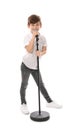 Cute little boy singing into microphone on white Royalty Free Stock Photo