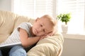 Cute little boy sleeping in papasan chair Royalty Free Stock Photo